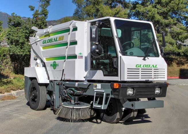 White Global M3 street sweeper with green stripes and a side broom, parked on pavement